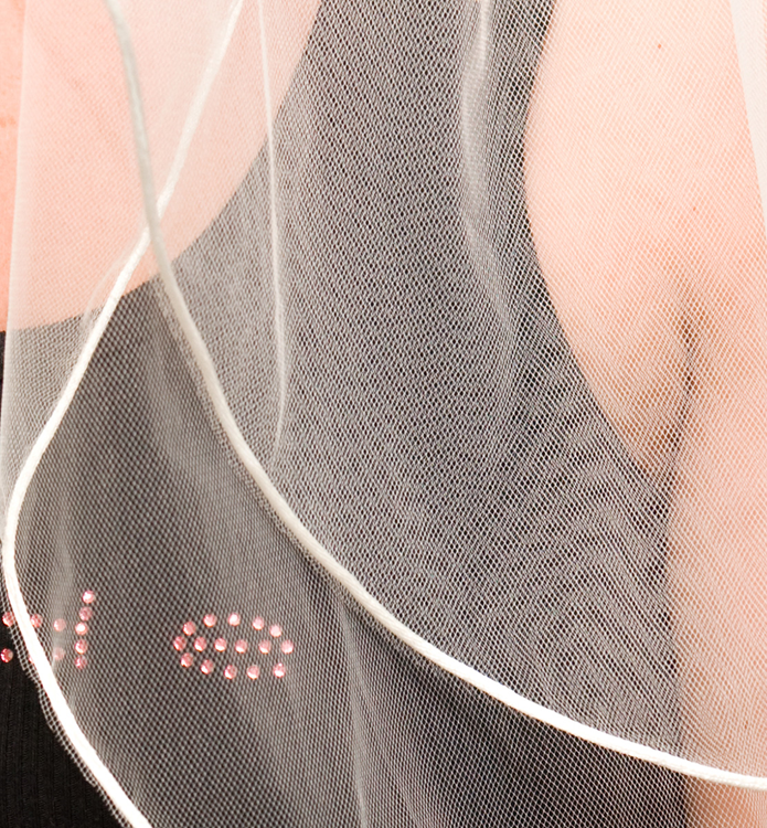 A close up of a veil

Description automatically generated