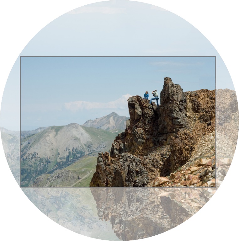 A group of people on a mountain

Description automatically generated