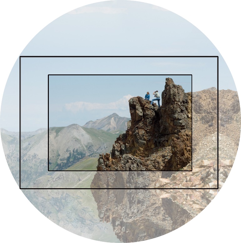 A group of people on a rock

Description automatically generated